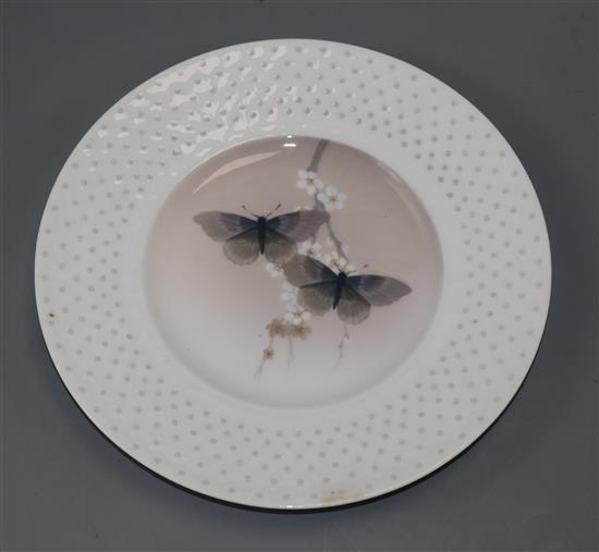 A rare set of six Royal Copenhagen plates, c.1898-1923, variously decorated with insects and flowers,